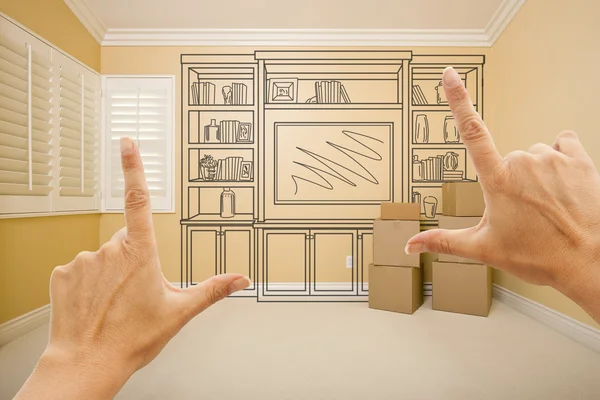 Framing Hands In Empty Room with Shelf Drawing on Wall
