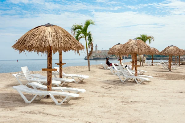 Art installation resembling a tropical beach at the Havana Bienn