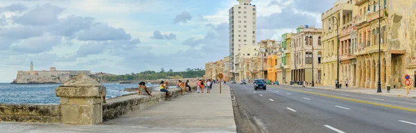 The Malecon in Havana with people and traffic