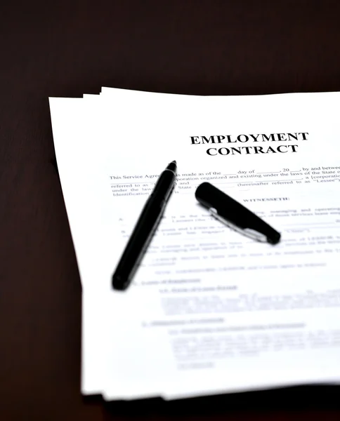 Employment Contract Document Agreement on Desk with Pen