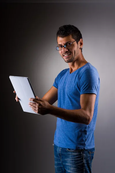 Young male executive using digital tablet