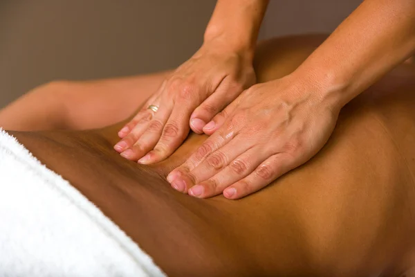 Woman receiving professional massage.