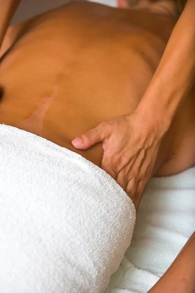 Woman receiving professional massage.