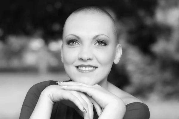 Beautiful young bald woman - cancer survivor