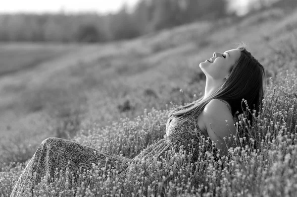 Happy girl lying on the meadow