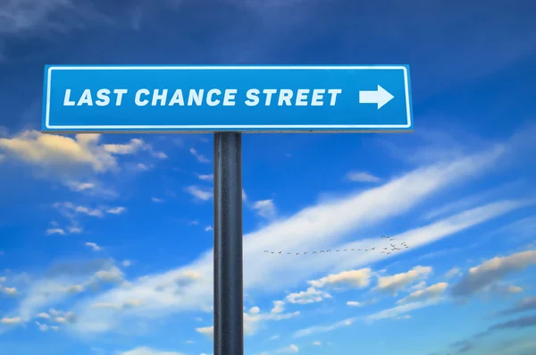 Last chance street slogan on the street sign against cloudy blue