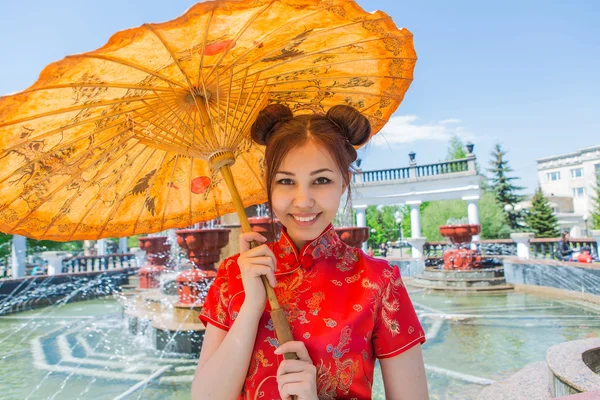 Beautiful asian girl in traditional chinese red dress.