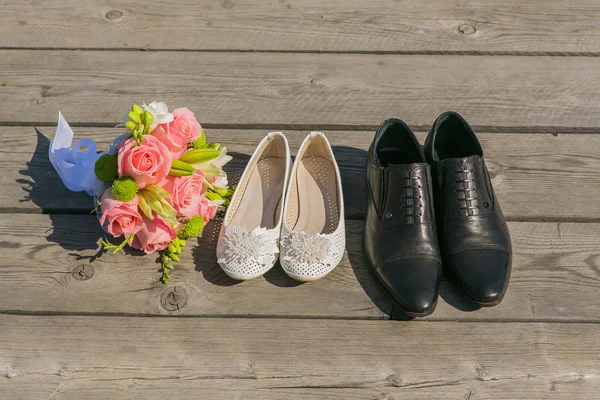 Bride and grooms shoe on the wooden floor