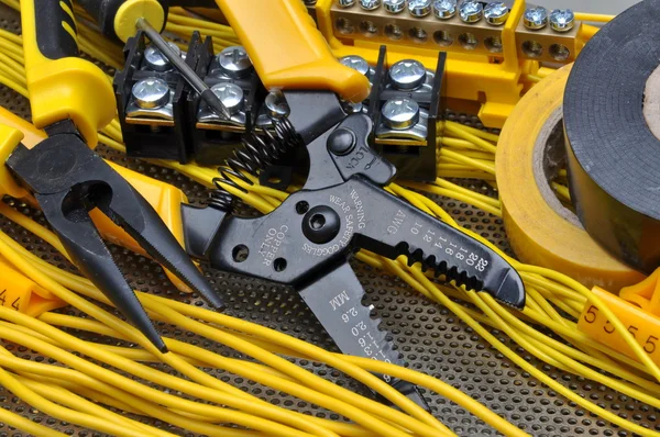 Pliers strippers with electrical component