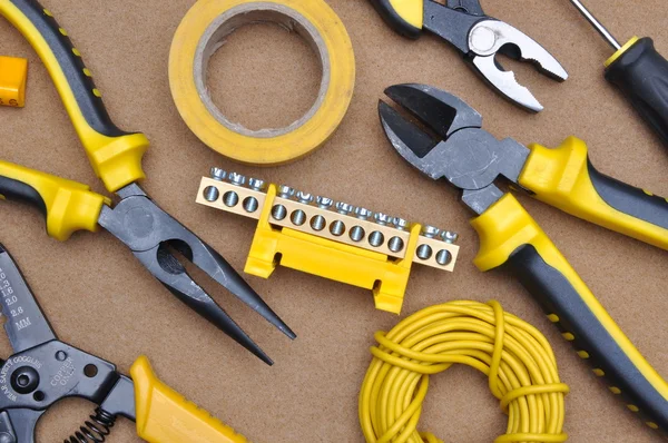 Tools for electrical installation on brown felt