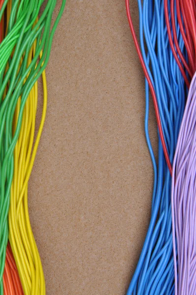 Color cables on brown felt