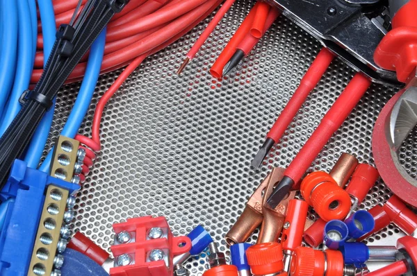 Electrical tools, component and cables on metal surface