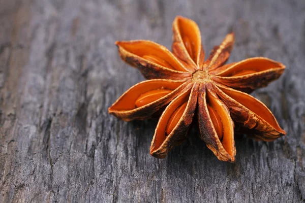 Anise star on wooden background