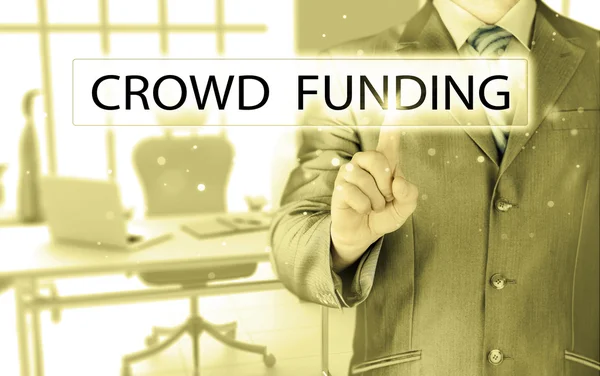 Businessman pushes virtual crowd funding button