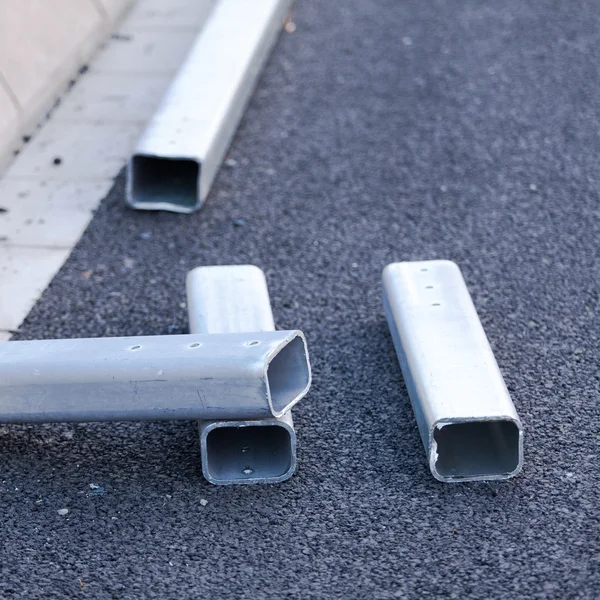 Workers install roadside fence