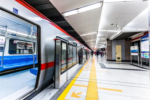 Moving train in subway station