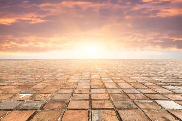 By bricks tiles in sunset