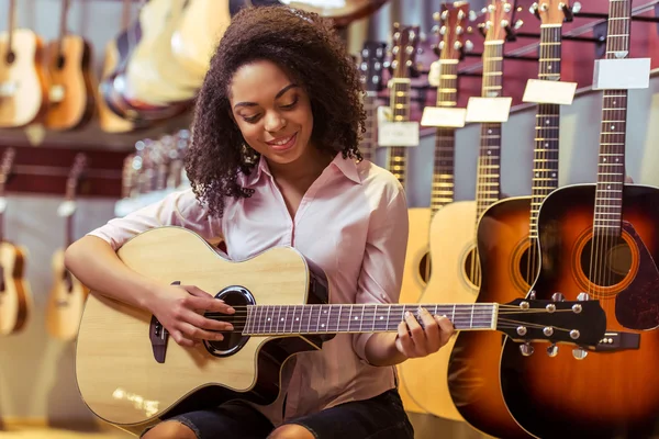 Woman playing guitar