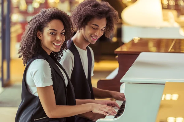 Couple playing piano