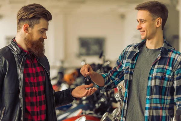 Men in motorbike salon