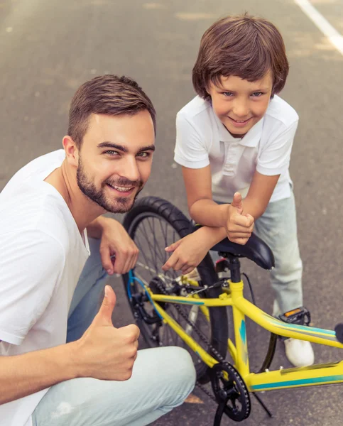 Dad and son cycling