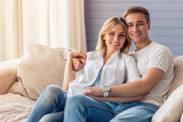 Beautiful young couple at home