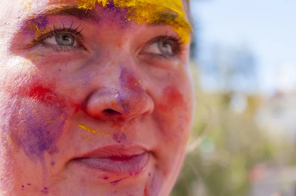 Colorful face in the indian festival Holi