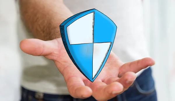 Man holding hand drawn shield safe protection icon