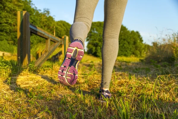 Woman running in a field