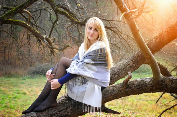 Beautiful young woman in autumn forest