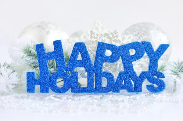 Inscription of happy holidays with christmas decorations