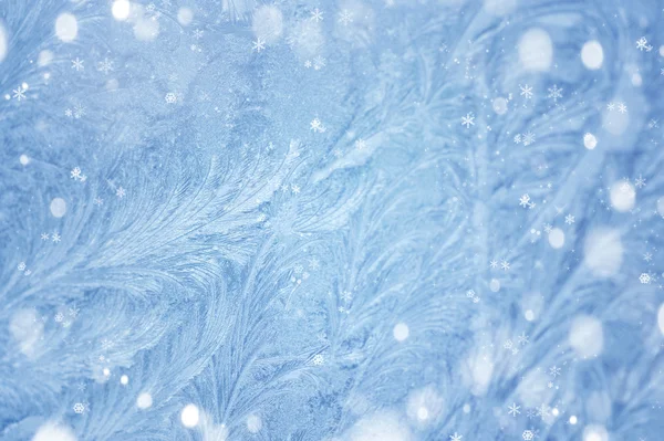 Winter background. Ice patterns on winter glass