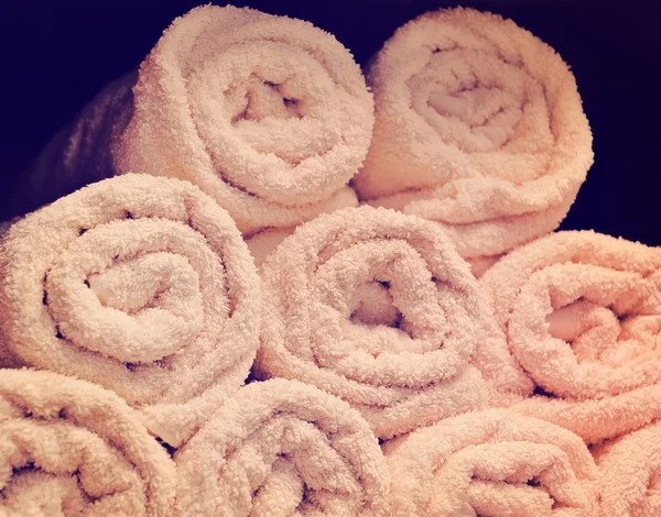 Rolled up white spa towels