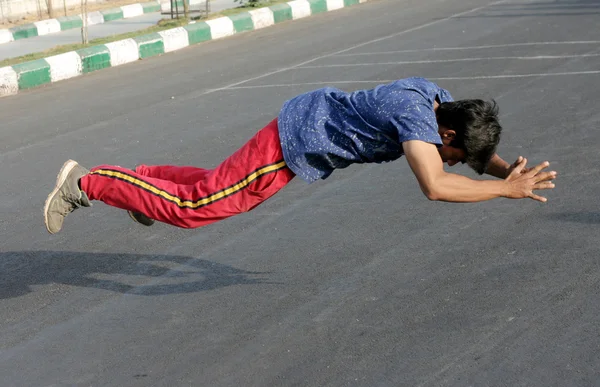 Indian man do push ups and jump up from the floor