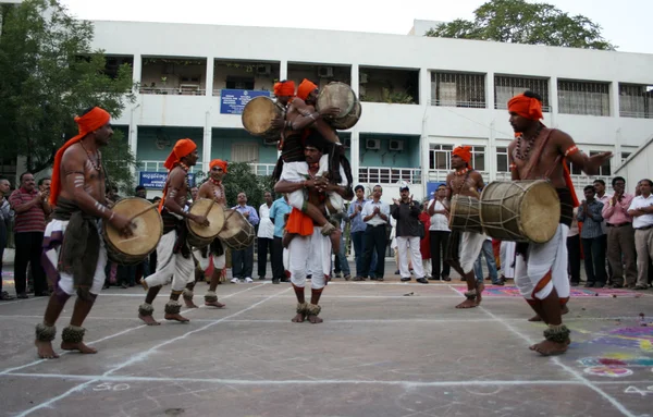 Indian tribal people dance during Hindu festival pongal