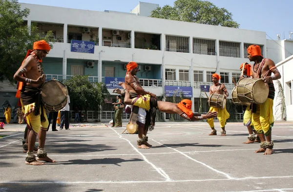 Indian tribal people dance during Hindu festival pongal