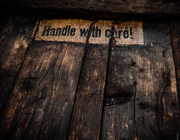 Grungy Handle With Care Sign