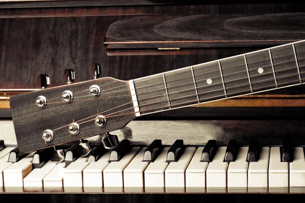 Guitar neck on old piano keys