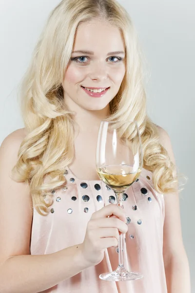 Young woman with a glass of white wine