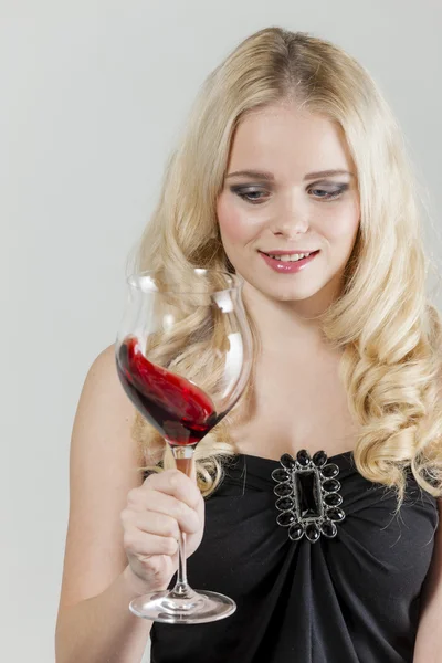 Young woman with a glass of red wine