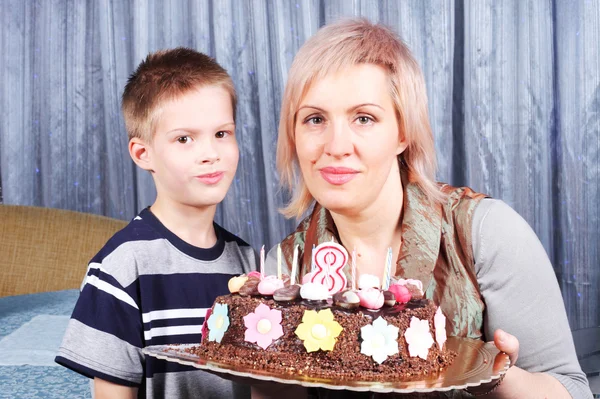Mother and child with cake