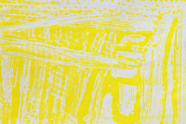 Strips yellow paint on paper