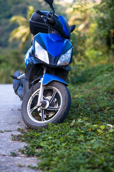 Motorcycle in the jungle at road on Koh Samui