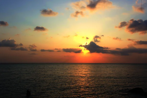 Beautiful sunset over sea with reflection in water. Koh Phangan