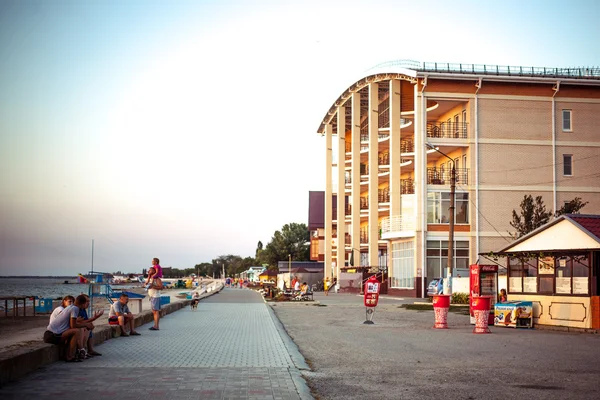 August 21, 2014, Azov sea, Russia. Hotel on the beach, and people, father with dad