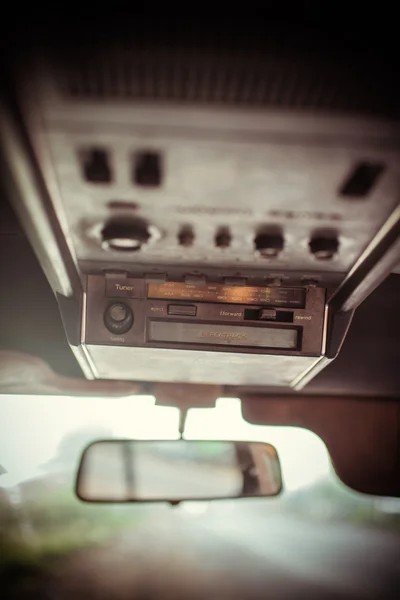 Radio cassette with mirror in retro car, Vintage picture