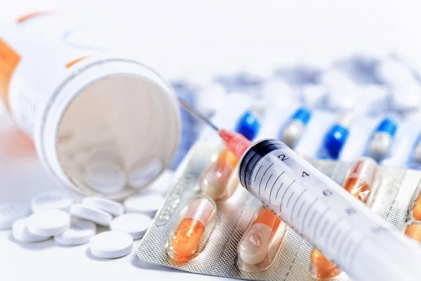 Syringe with medications pills drug