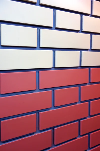Wall panel under a brick