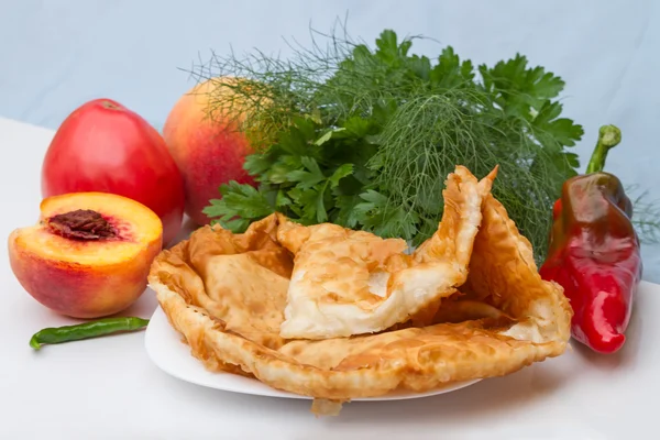 Hot cheburek with vegetables and fruits