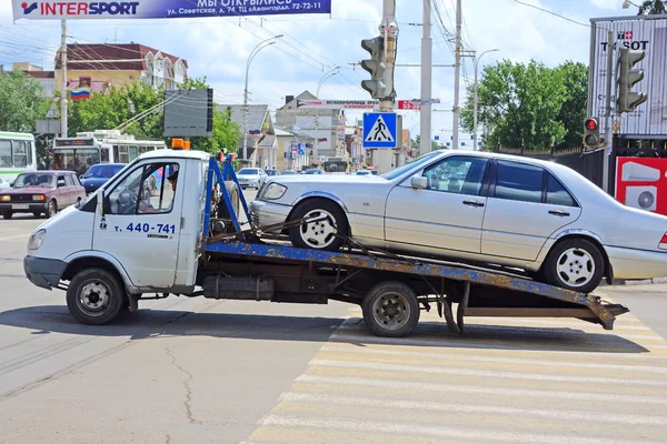 Tow truck with a car